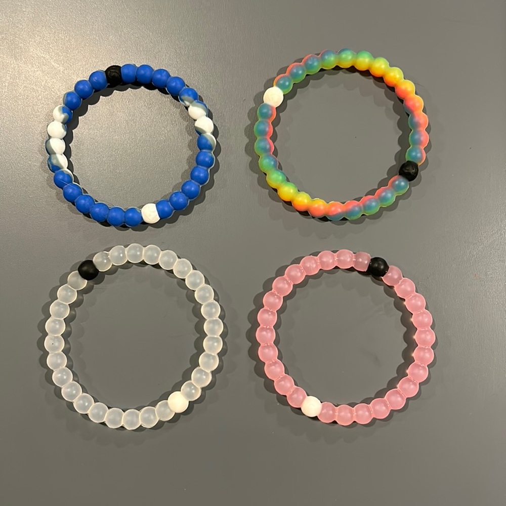Four Lokai bracelets